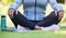 Yoga meditation, legs or nature person meditate for spiritual healing, chakra energy balance or park freedom. Closeup