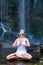 Yoga meditation near waterfall