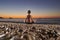 Yoga and meditation on the quiet beach at sunrise