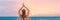 Yoga meditation woman meditating at beach sunset relaxing in yoga tree pose doing sun salutation. Relaxing serene woman