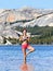 Yoga meditation woman meditating in nature lake