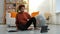 Yoga mindfulness meditation. Young healthy African girl practicing yoga at home. Woman sitting in lotus pose on yoga mat