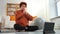 Yoga mindfulness meditation. Young healthy African girl practicing yoga at home. Woman sitting in lotus pose on yoga mat