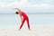 Yoga outdoor. Happy woman doing yoga exercises, meditate on the beach. Yoga meditation in nature. Concept of healthy lifestyle and