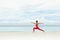 Yoga outdoor. Happy woman doing yoga exercises, meditate on the beach. Yoga meditation in nature. Concept of healthy lifestyle and