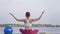 Yoga outdoors, young attractive yogi girl in lotus position meditates and enjoy spiritual calmnes on nature