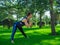 Yoga at park. Caucasian middle-aged woman exercising outdoors