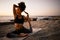 Yoga is the perfect way to stay limber. Full length shot of an attractive young woman practicing yoga on the beach at