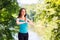 Yoga. Portrait of sportswoman exercising in park.