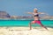 Yoga pose, fit woman exercise on beach