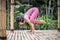 Yoga practice outdoor. Asian yoga teacher practicing Bakasana, Crow pose. Balancing asana in hatha yoga. Yoga retreat. Bali,