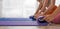 Yoga practitioners rolling mats after class