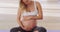 Yoga, rubbing and stomach of pregnant woman for workout, health or exercise. Wellness, pilates and pregnancy with mother