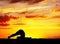 Yoga silhouette Halasana plough pose