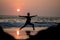 Yoga silhouette at ocean cost and sunset India