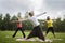 Yoga sportsmen in park - performs exercise outdoors outdoor at morning