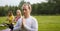 Yoga sportsmen in park - performs exercise outdoors outdoor at morning