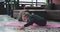 Yoga stretching body young lady with blonde hair practicing in the morning on the mat in the modern penthouse with a big