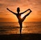 Yoga, stretching and silhouette of woman on beach at sunrise for exercise, training and pilates workout. Motivation