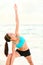 Yoga stretching woman on beach