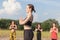 yoga teacher and students practicing yoga outdoors