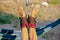 Yoga treatment for core yoga swing, slim young man strapped to four planks above floor with exercise mat, man developing