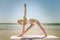 Yoga utthita trikonasana triangle pose by woman in