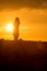 Yoga Woman doing yoga pose outside in sunset