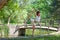 Yoga woman instructor practice yoga outdoor in park by the pond