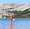 Yoga woman meditating in nature meditation retreat