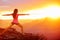Yoga woman meditating at sunset in Grand Canyon