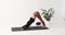 Yoga woman performs exercises Chaturanga Dandasana, plank pose and Adho Mukha Svanasana, downward facing dog pose with jumping