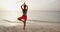 Yoga woman pose at beach