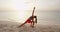 Yoga woman pose at beach