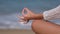 yoga woman practicing yoga and meditates in lotus position on beach sea