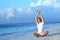 Yoga woman on sea coast