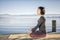 Yoga woman sitting lake