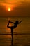 Yoga women silhouette at sunset