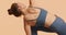 Yoga workout close-up video. Pretty female wearing modern comfort sportswear doing Extended Side Angle Pose