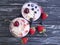 Yoghurt, strawberry, cherry, morning blueberry glass on a black wooden background