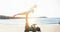 Yogi couple of friends doing acro yoga outdoor on the beach - People training on evening time at sunrise - Focus on bodies -