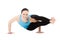 Yogi female in yoga asana Astavakrasana, Eight-Angle Pose