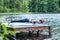 yogi  girl  practicing yoga, doing four limbed staff, chaturanga dandasana pose, on the lake.  Concept of healthy life and