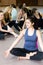 Yogi girl sitting in lotus posture in class