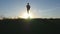 Yogi practicing yoga moves and positions in nature. Silhouette of sporty man standing at yoga pose outdoor. Athlete