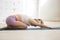 Yogi woman doing restorative asana