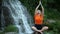 Yogic meditation practice Yogic doing yoga on the rocks against the waterfall