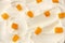 yogurt background with mango pieces. yogurt texture. top view
