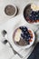 Yogurt with berries, banana, almonds and Chia seeds, bowl of healthy Breakfast every morning, vintage style, superfood and detox