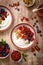 Yogurt with berries on wooden background. White plain greek yogurt with fresh berries and granola